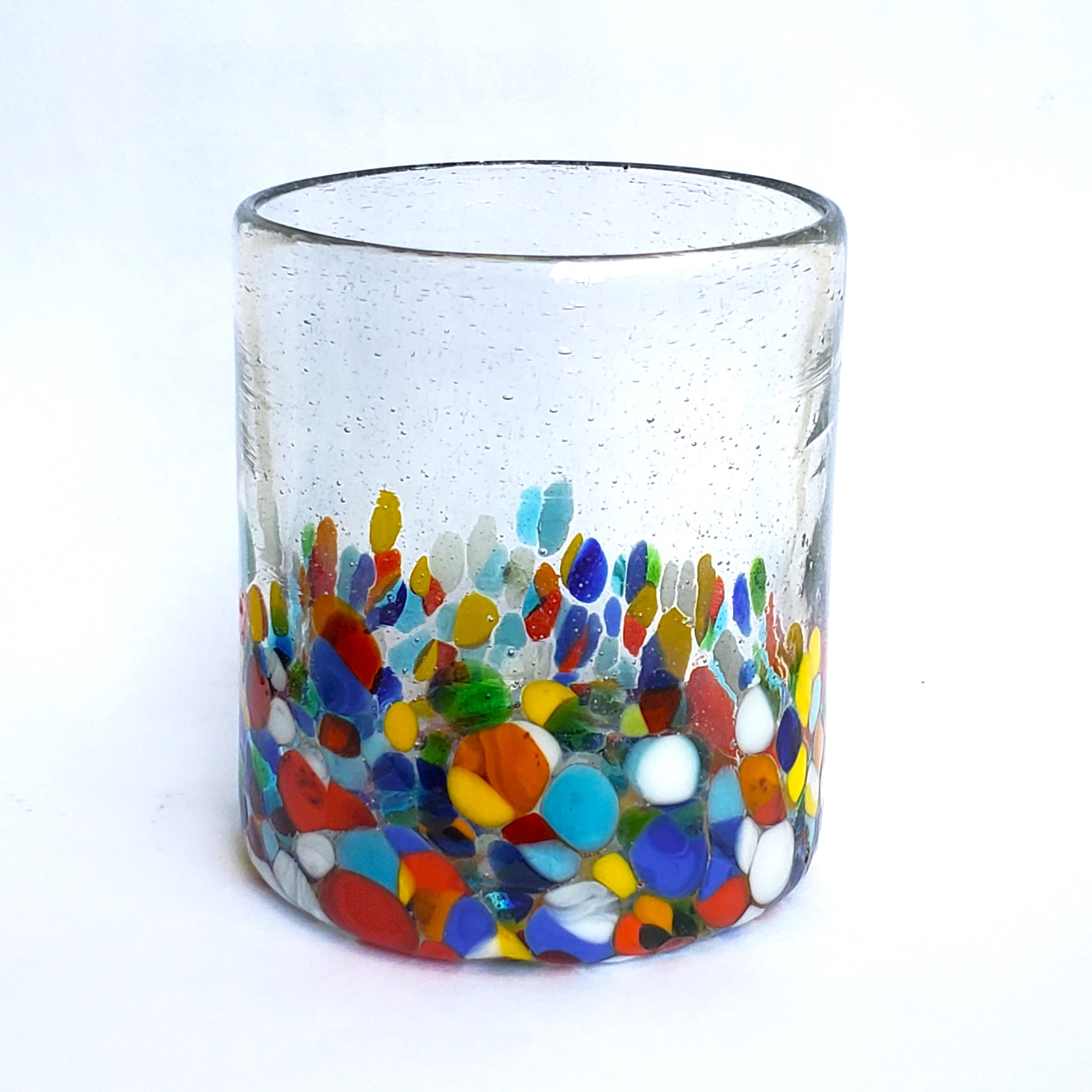 New Items / Clear & Confetti 9 oz Short Tumblers  / Our Clear & Confetti Glassware combines  the best of two worlds: clear, thick, sturdy handcrafted glass on top, meets the colorful, festive, confetti bottom! These glasses will sure be a standout in any table setting or as a fabulous gift for your loved ones. Crafted one by one by skilled artisans in Tonala, Mexico, each glass is different from the next making them unique works of art. You'll be amazed at how they make having a simple glass of water a happier experience. Made from eco-friendly recycled glass.